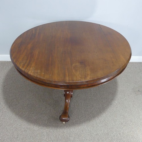 565 - A 19th century mahogany circular breakfast Table, raised on a turned column and three scrolled suppo... 