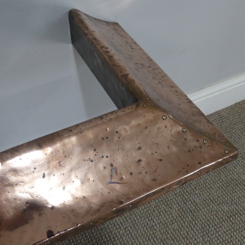 669 - An Arts and Crafts hammered copper Fender, of studded construction, W 128 cm x D 37 cm. ... 