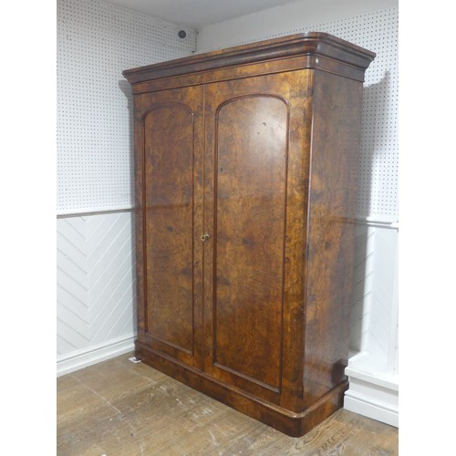 561 - A Victorian burr walnut compactum Wardrobe, the moulded cornice over two doors concealing interior w... 