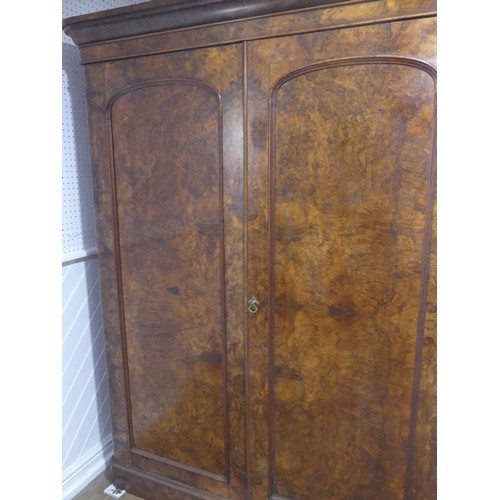 561 - A Victorian burr walnut compactum Wardrobe, the moulded cornice over two doors concealing interior w... 