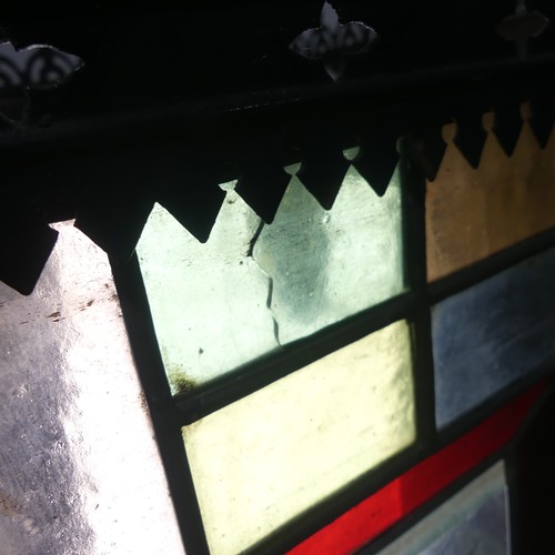 753 - An Arts and Crafts stained glass Lantern, the four panels of lead lined glass mounted in a gothic st... 