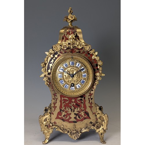 711 - A late 19th century French brass mounted and red tortoiseshell Boulle mantel Clock, the brass-cast d... 