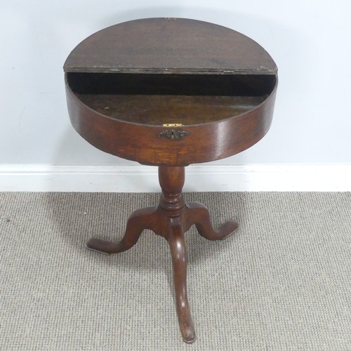 759 - An early 20th century oak drum tripod Table, the hinged circular top raised on turned column, upon c... 