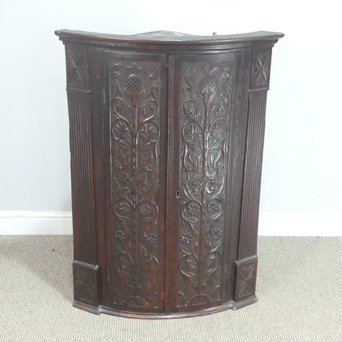 761 - An 18th century carved oak corner Cupboard, W 72 cm x H 101 cm x D 46 cm.