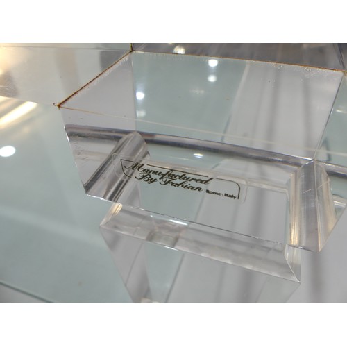 608 - An Italian Lucite and glass topped coffee Table, c.1970, by Fabian Art, Rome, with glass shelf under... 