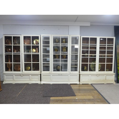 651 - A very large 19th century painted pine glazed Bookcase, with later additions, made up of three secti... 