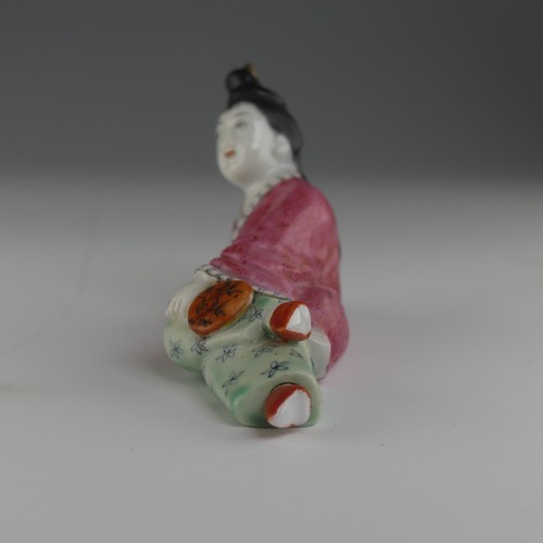 104 - An early 20thC Chinese famille rose porcelain Snuff Bottle, in the form of a recumbent woman with a ... 