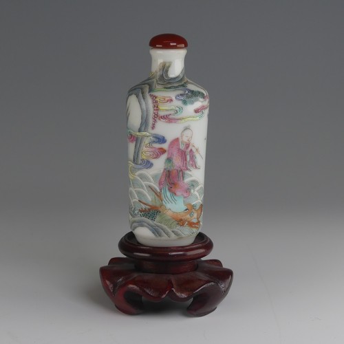 105 - A Chinese famille rose porcelain Snuff Bottle, decorated in fine enamels of an elder riding a dragon... 