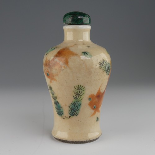 106 - A Chinese celadon porcelain Snuff Bottle, of shouldered baluster form, decorated with koi karp and f... 