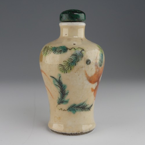 106 - A Chinese celadon porcelain Snuff Bottle, of shouldered baluster form, decorated with koi karp and f... 