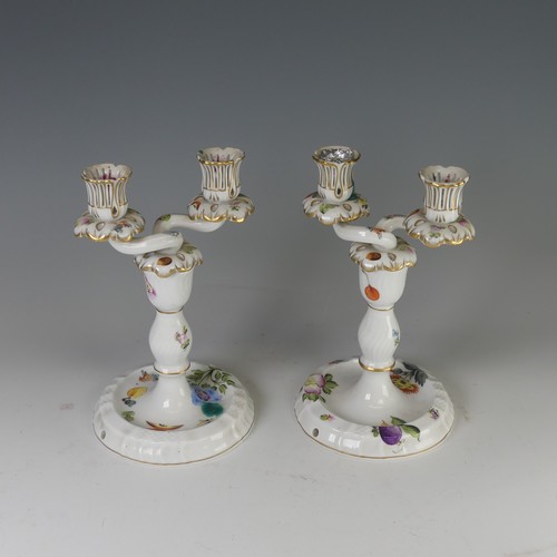 16 - A pair of Herend porcelain two-branch Candlesticks, finely painted with fruits and flora, factory ma... 