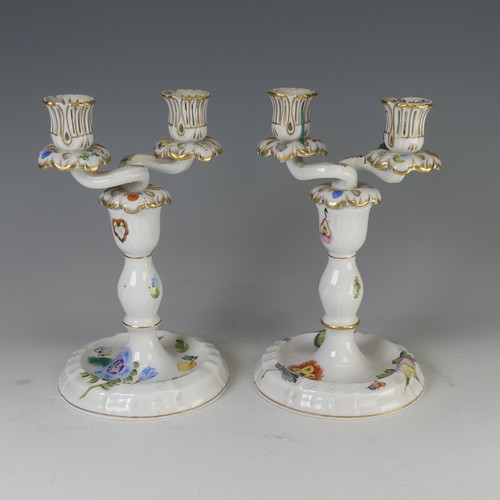 16 - A pair of Herend porcelain two-branch Candlesticks, finely painted with fruits and flora, factory ma... 