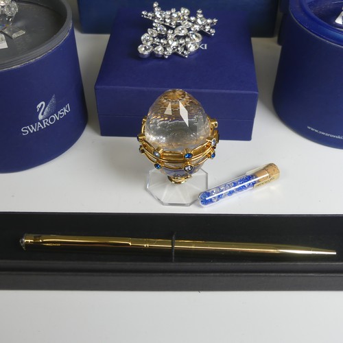 18 - A quantity of Swarovski Items, to comprise a Brooch, Pen and Crystal Egg, together with various Swar... 