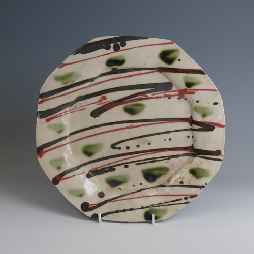 30 - Sandy Brown (b. 1946) a studio pottery Dish, of octagonal form decorated in colourful slips, D 28cm,... 