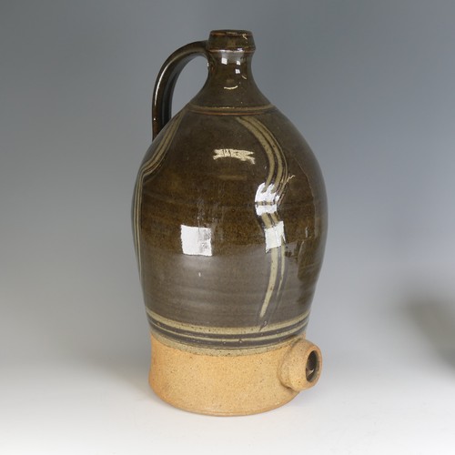 32 - A large Dartington Pottery cider Flagon, with combed slip decoration, lacking tap, impressed signatu... 