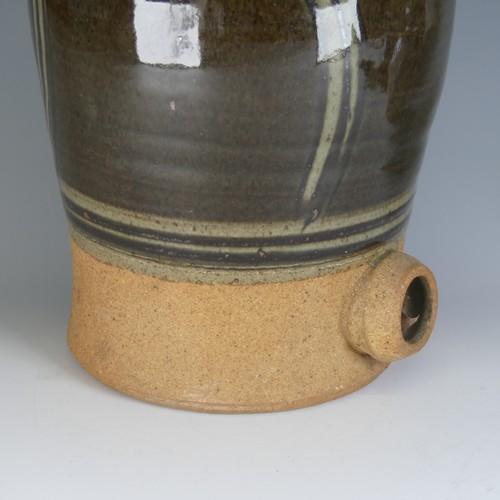 32 - A large Dartington Pottery cider Flagon, with combed slip decoration, lacking tap, impressed signatu... 