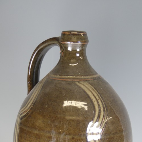 32 - A large Dartington Pottery cider Flagon, with combed slip decoration, lacking tap, impressed signatu... 