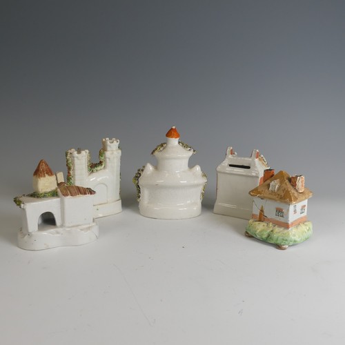 35 - Four Staffordshire cottage Paster Burners, the largest 14cm high, chips and losses commensurate with... 