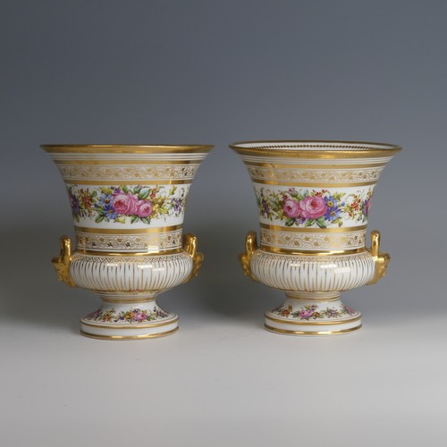 40 - A pair of late 19thC French porcelain Urns, decorated with gilded bands of vines, with central depic... 