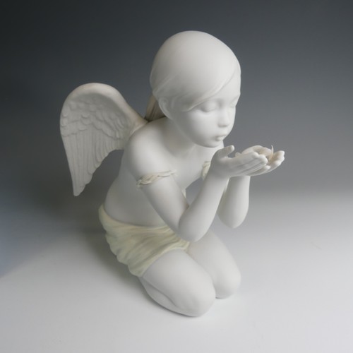 43 - A Lladro figure of 'A Fantasy Breath', modelled as an angel girl blowing flower petals, H 25cm. Boxe... 