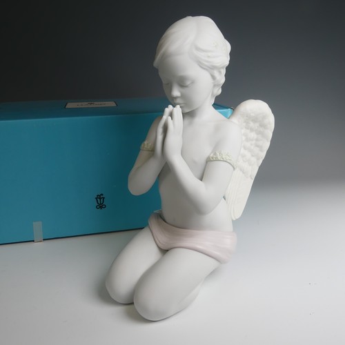 47 - A Lladro figure of 'Heavenly Prayer', modelled as an angel praying in the shape of a girl decorating... 