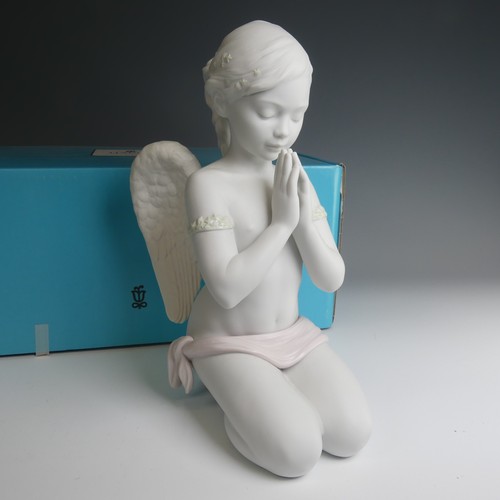 47 - A Lladro figure of 'Heavenly Prayer', modelled as an angel praying in the shape of a girl decorating... 