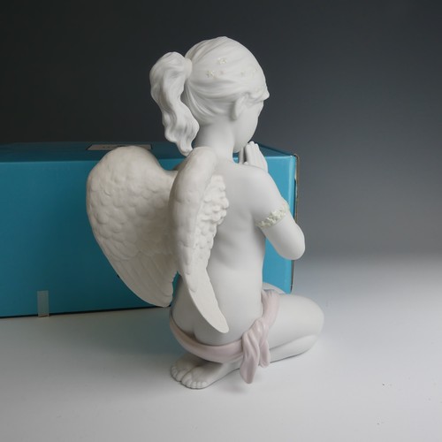 47 - A Lladro figure of 'Heavenly Prayer', modelled as an angel praying in the shape of a girl decorating... 