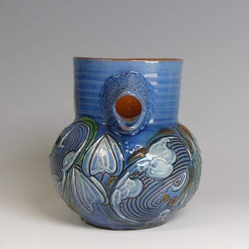 59 - A C. H. Brannam pottery fish Jug, with fish mouth as a spout, decorated to blue ground with floral m... 