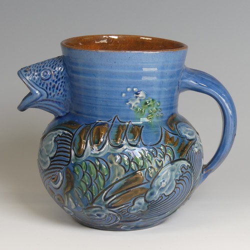 59 - A C. H. Brannam pottery fish Jug, with fish mouth as a spout, decorated to blue ground with floral m... 