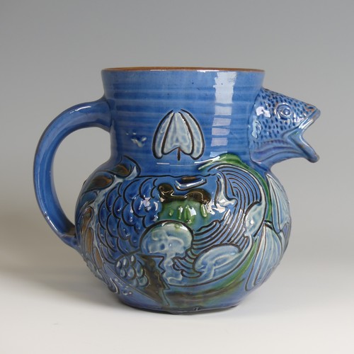 59 - A C. H. Brannam pottery fish Jug, with fish mouth as a spout, decorated to blue ground with floral m... 