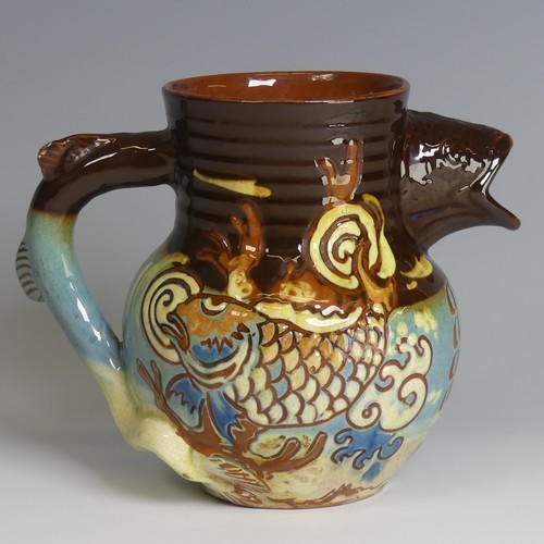 60 - A C. H. Brannam pottery fish Jug, with fish mouth for spout and fish tail for handle, decorated with... 