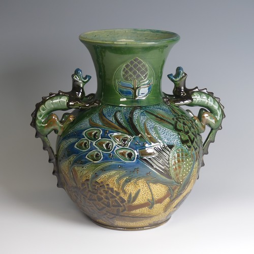 66 - A C. H. Brannam pottery twin-handled Vase, bulbous body with flared rim, decorated with an exotic bi... 