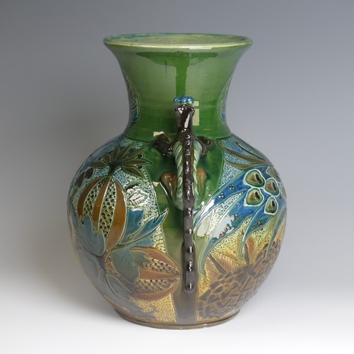 66 - A C. H. Brannam pottery twin-handled Vase, bulbous body with flared rim, decorated with an exotic bi... 