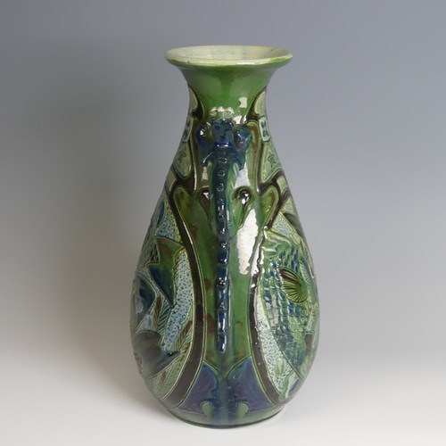 67 - A C. H. Brannam pottery twin-handled Vase, with bulbous body and flared rim, decorated with intertwi... 