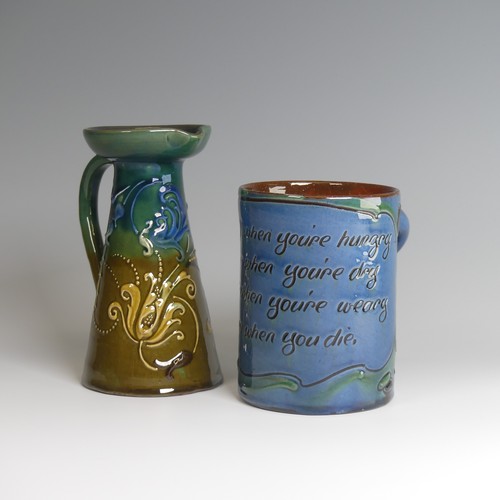 70 - A C. H. Brannam pottery Mug, decorated with rhyming verse, with depictions of koi carp in tones of g... 