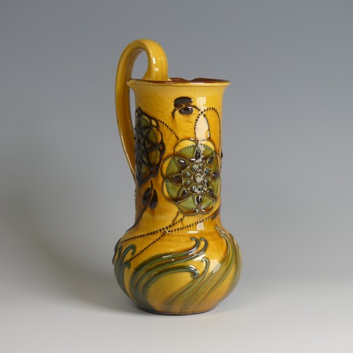 73 - Frederick Braddon for C. H. Brannam pottery Jug, with bulbous base and cylindrical neck, decorated i... 