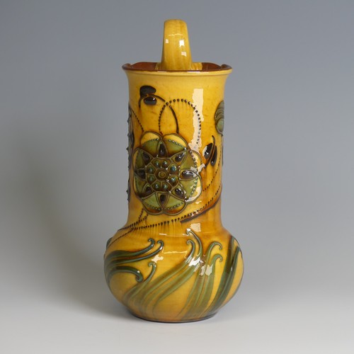 73 - Frederick Braddon for C. H. Brannam pottery Jug, with bulbous base and cylindrical neck, decorated i... 