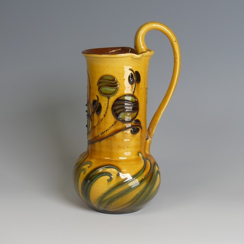 73 - Frederick Braddon for C. H. Brannam pottery Jug, with bulbous base and cylindrical neck, decorated i... 