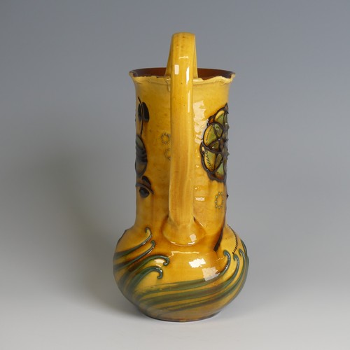 73 - Frederick Braddon for C. H. Brannam pottery Jug, with bulbous base and cylindrical neck, decorated i... 