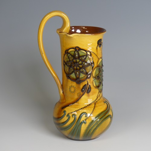 73 - Frederick Braddon for C. H. Brannam pottery Jug, with bulbous base and cylindrical neck, decorated i... 