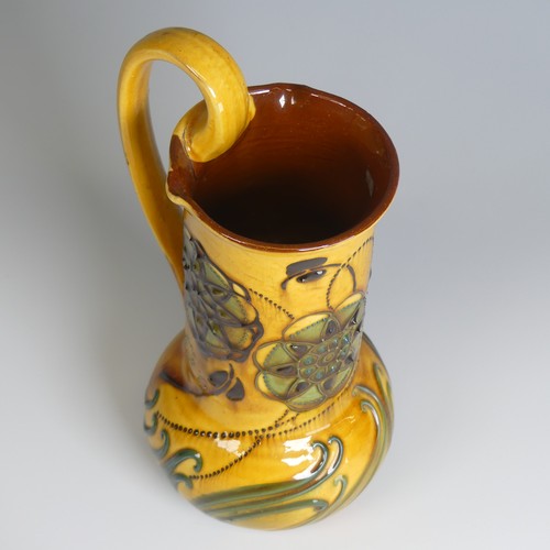 73 - Frederick Braddon for C. H. Brannam pottery Jug, with bulbous base and cylindrical neck, decorated i... 