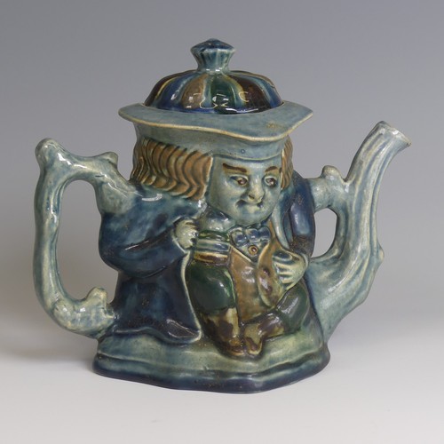 77 - Lauder Barum for Devonia Art Pottery; a character Teapot, modelled as a man holding mug, foliage sha... 