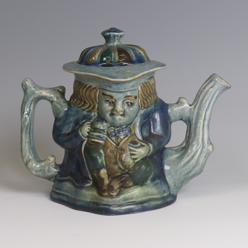 77 - Lauder Barum for Devonia Art Pottery; a character Teapot, modelled as a man holding mug, foliage sha... 