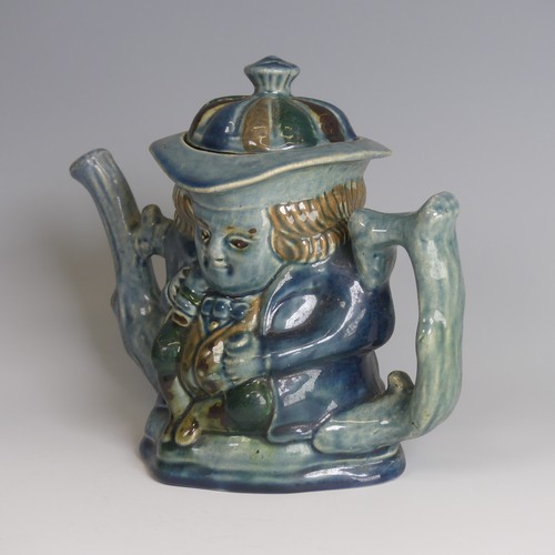 77 - Lauder Barum for Devonia Art Pottery; a character Teapot, modelled as a man holding mug, foliage sha... 