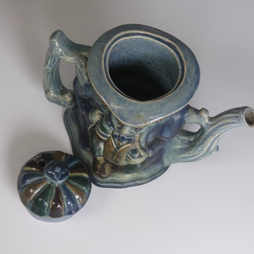 77 - Lauder Barum for Devonia Art Pottery; a character Teapot, modelled as a man holding mug, foliage sha... 