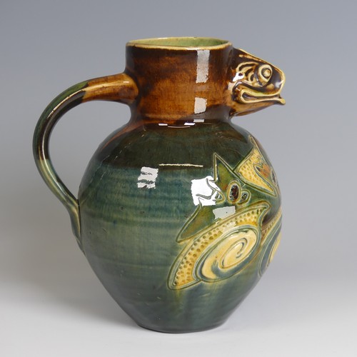 79 - A William Baron pottery fish Jug, with fish mouth for spout, decorated in greens, blues and browns w... 