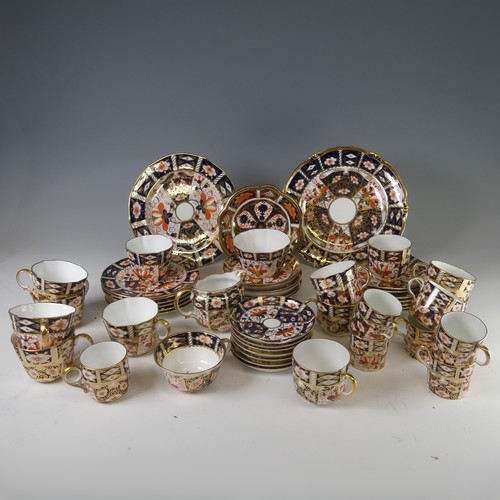 86 - A Royal Crown Derby Imari pattern 2451 tea service, of lobed form, comprising six cups and six sauce... 