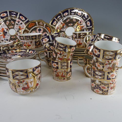 86 - A Royal Crown Derby Imari pattern 2451 tea service, of lobed form, comprising six cups and six sauce... 