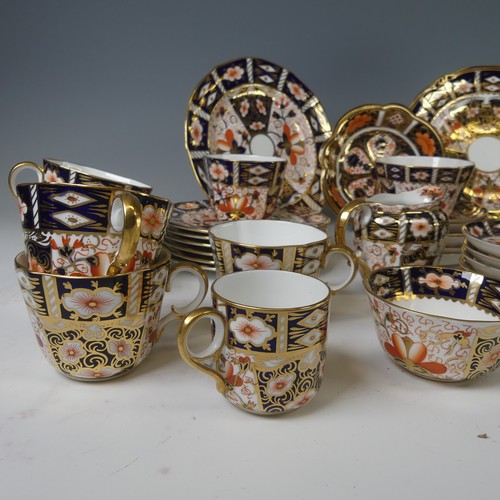 86 - A Royal Crown Derby Imari pattern 2451 tea service, of lobed form, comprising six cups and six sauce... 