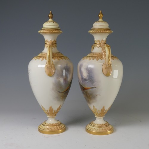 88 - A pair of Royal Worcester twin-handled Vases and covers, painted with Pheasants in naturalistic and ... 